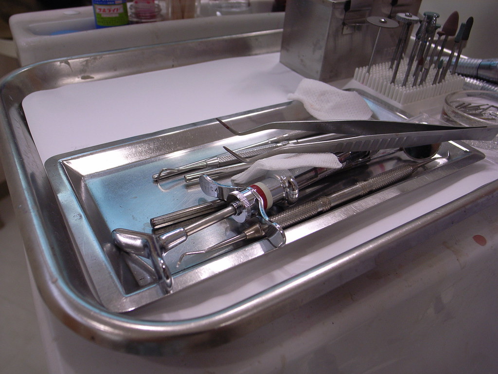 Sterilised dental instruments laid out on a tray in a dental clinic